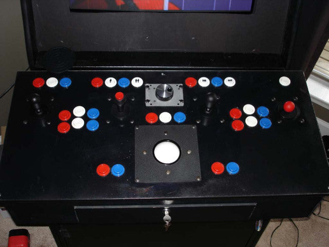 Full on control panel with trackball, joysticks and buttons
