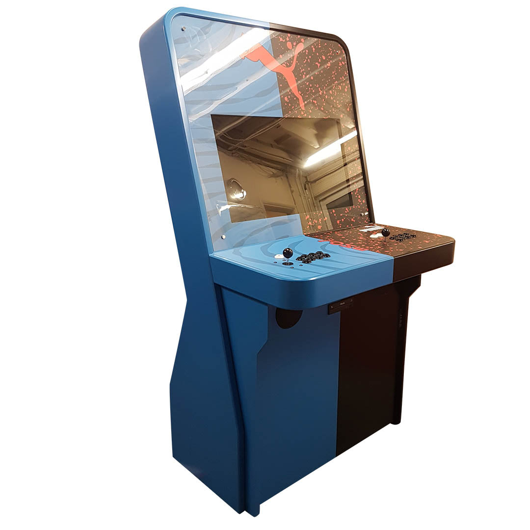 Nu-Gen Stand-up Media arcade machine in blue and black with Puma decals front left profile